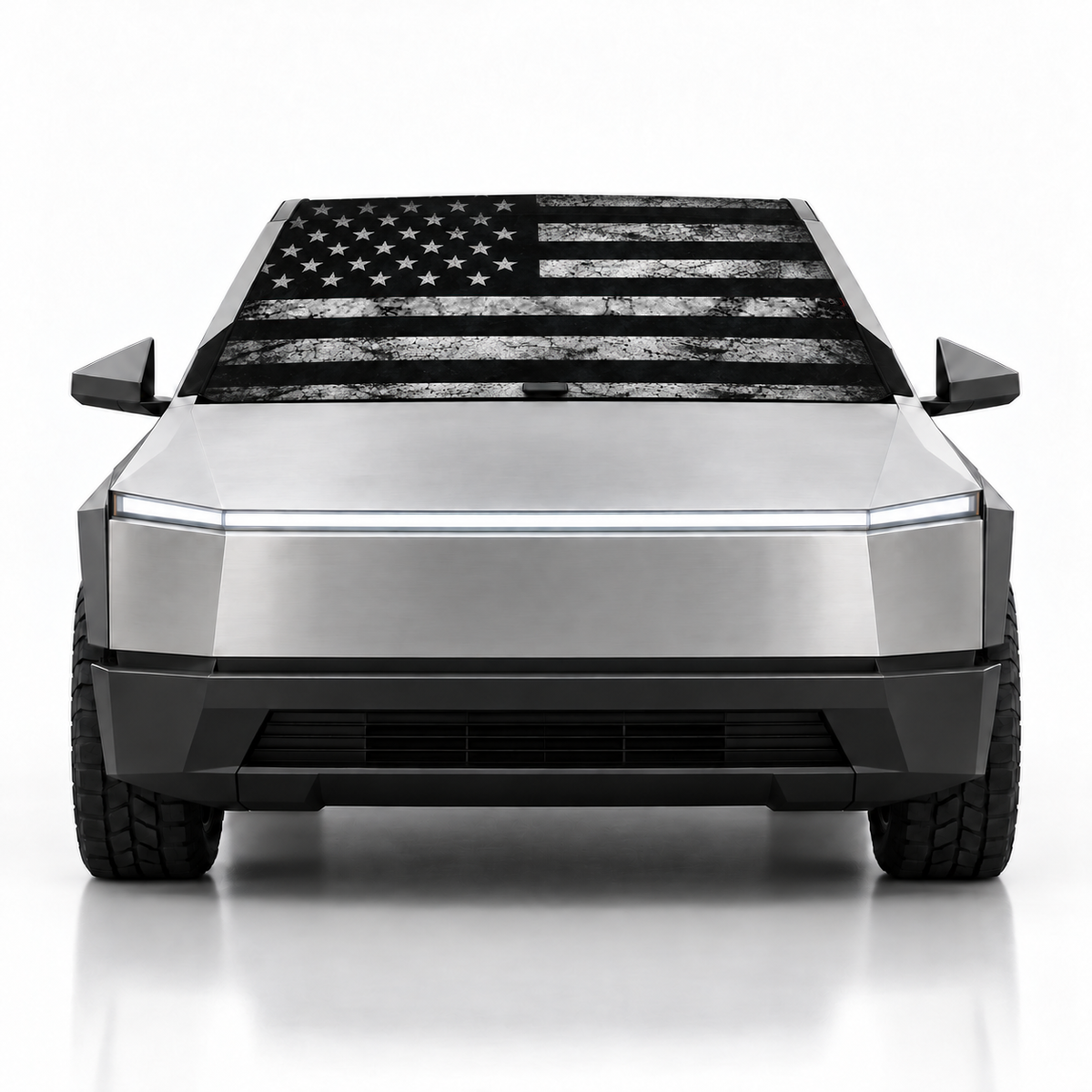 Front view of silver Tesla Cybertruck with USA Distressed print (black and white distressed American flag) Solar Shield on windshield | Spider Web Shade