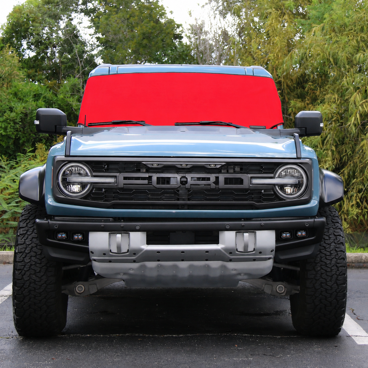 Red Spider Web Shade Solar Shield on Ford Bronco Raptor windshield, front view - custom fit Ford Bronco 2021-2026 sun shade