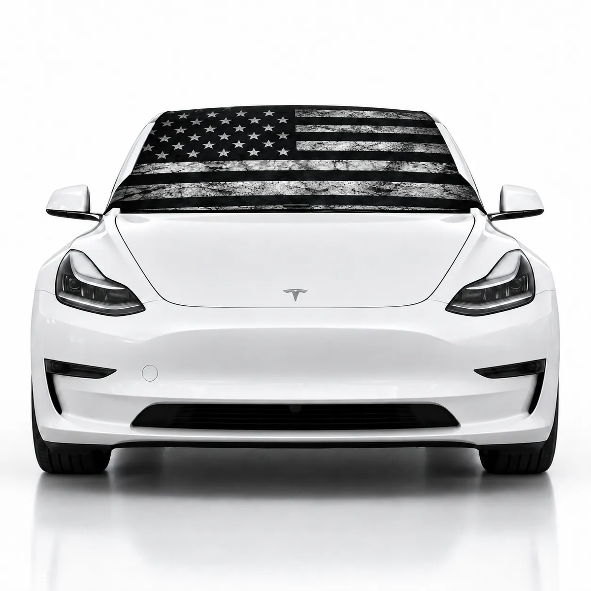 Front view of white Tesla Model 3 with USA Distressed print (black and white distressed American flag) Solar Shield on windshield | Spider Web Shade