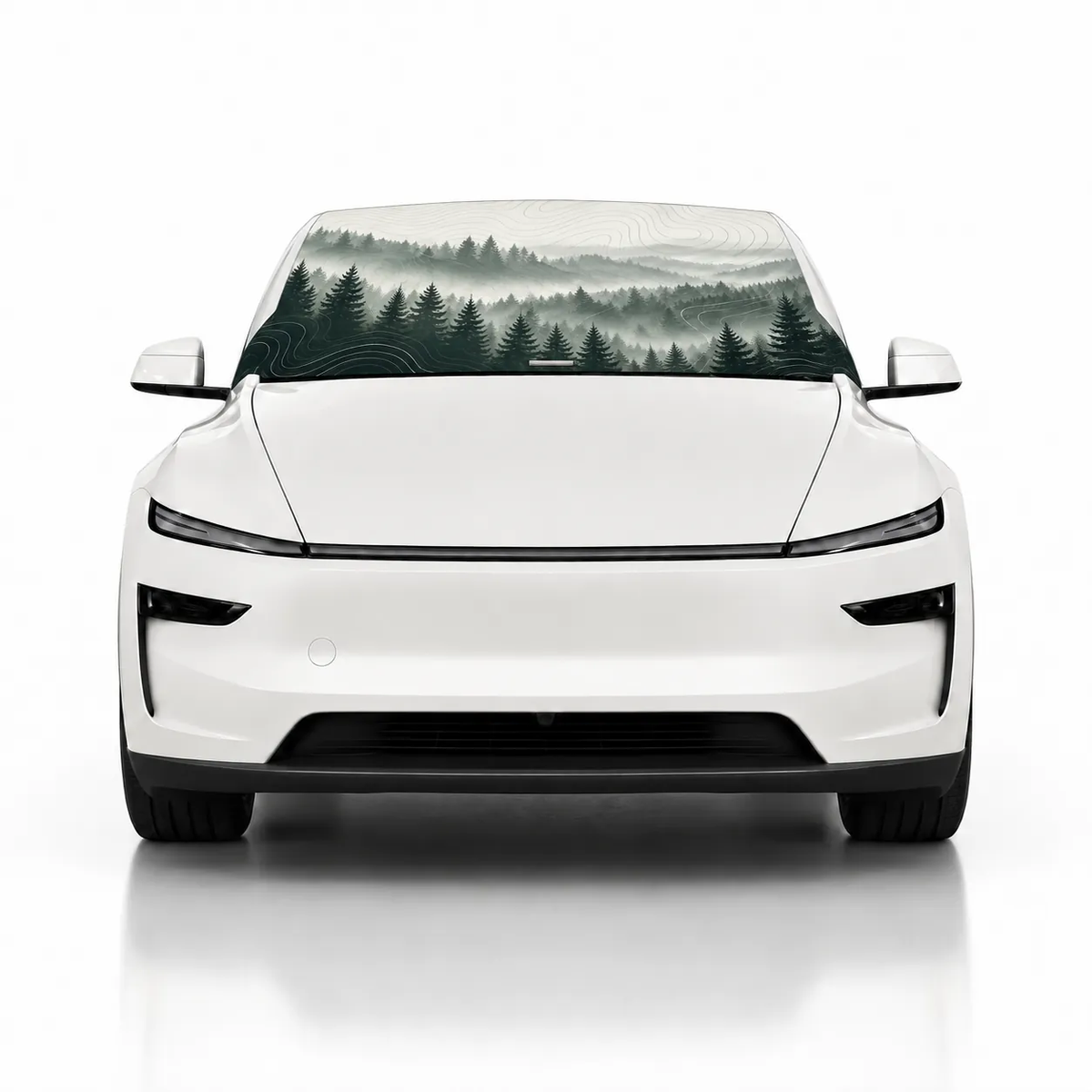 Front view of white Tesla Model Y with Misty Pines print (misty pine forest) Solar Shield on windshield | Spider Web Shade