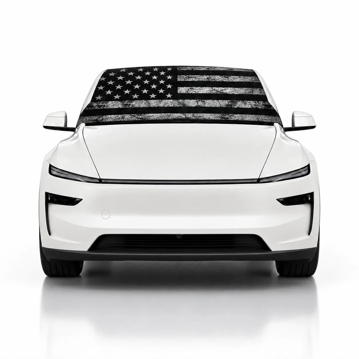 Front view of white Tesla Model Y with USA Distressed print (black and white distressed American flag) Solar Shield on windshield | Spider Web Shade