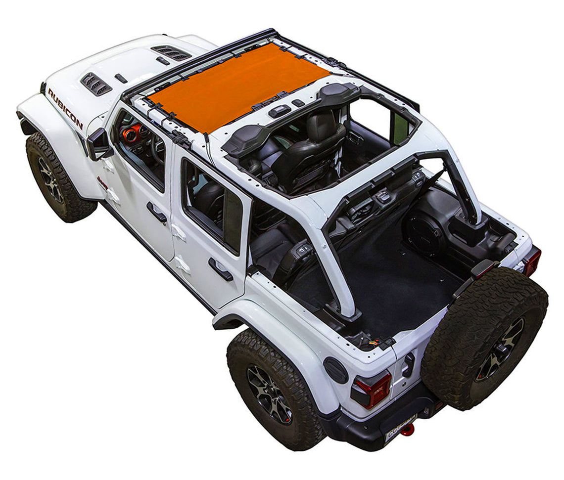 White Rubicon JL four door Jeep with orange SPIDERWEBSHADE shade on top that only covers front seat riders from windshield frame extending to the rear to the sound bar.