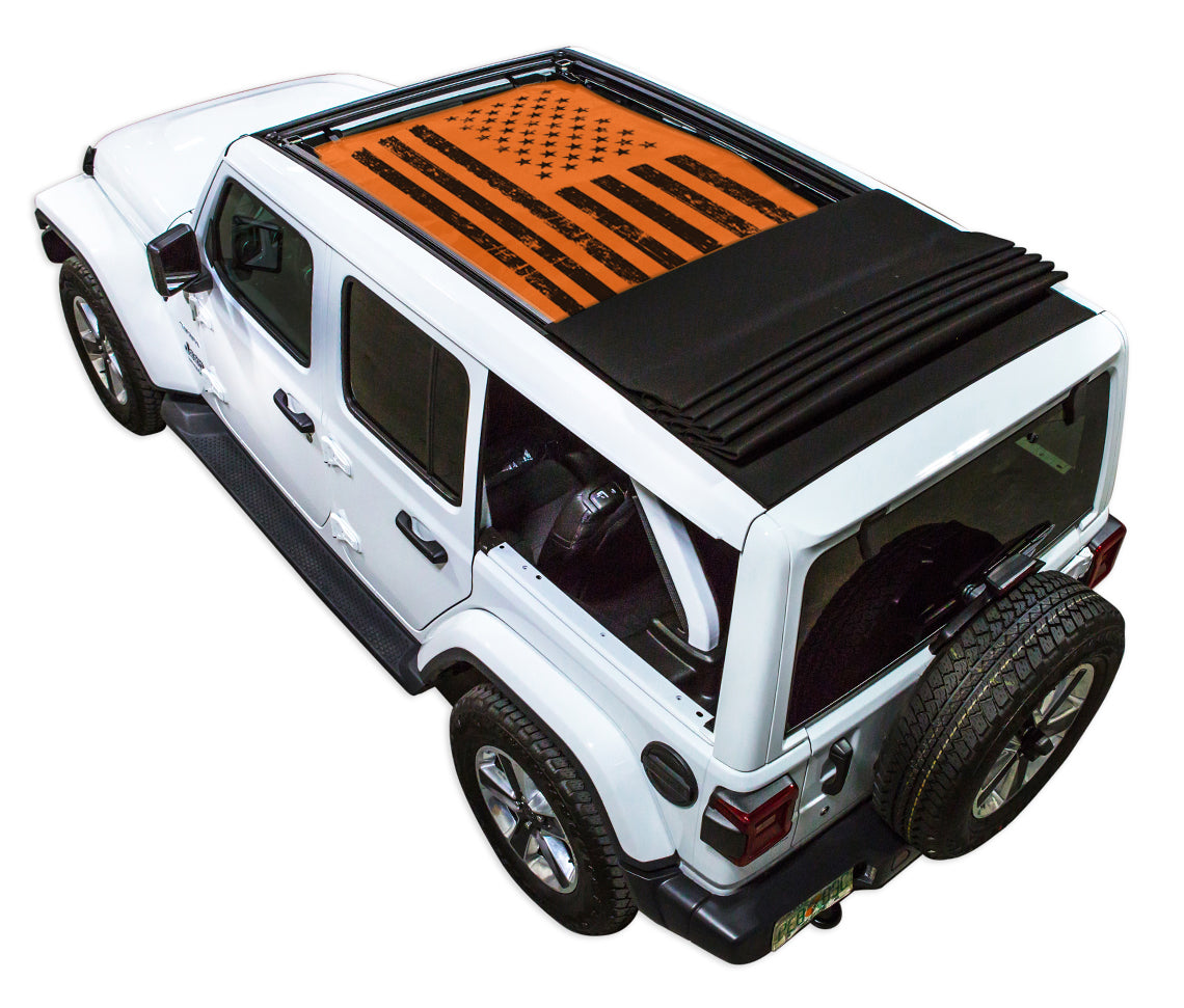 White JL four door Power Top Jeep with Distressed Tactical American Flag orange SPIDERWEBSHADE shade on top that covers front and rear passenger seats.