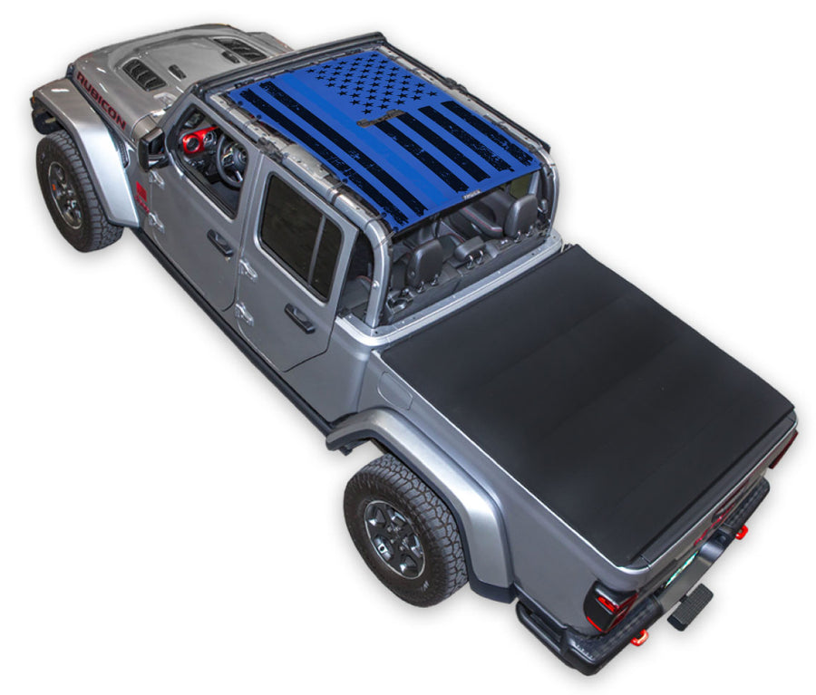Silver Gladiator JT four door Jeep with Distressed Thin Blue Line tactical Flag Blue SPIDERWEBSHADE shade on top that covers front and rear passenger seats.