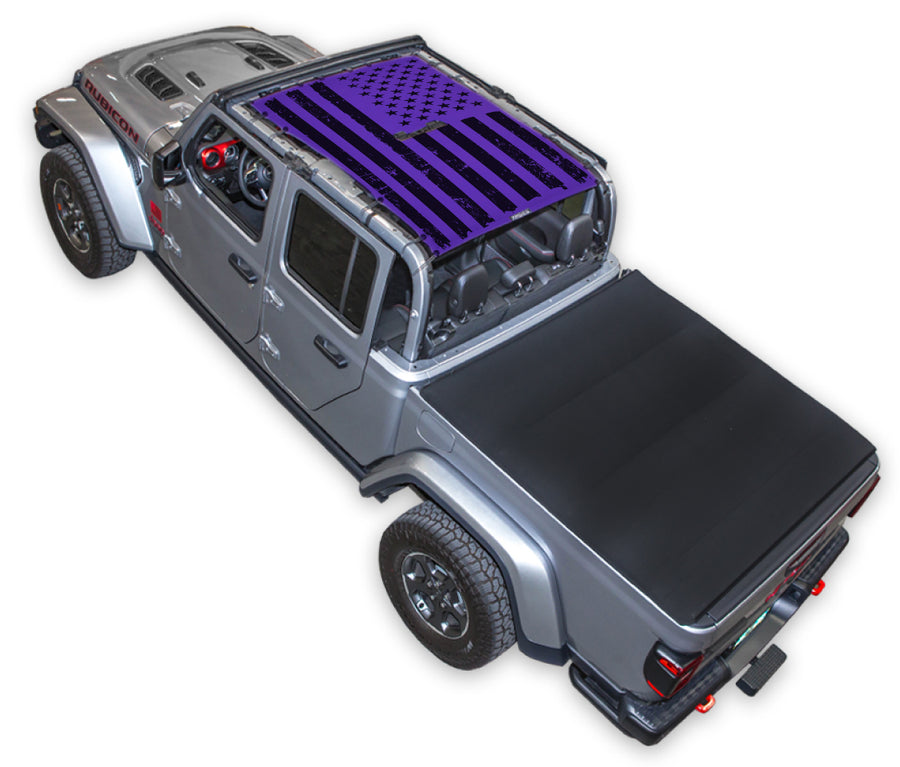 Silver Gladiator JT four door Jeep with Distressed tactical Flag Purple SPIDERWEBSHADE shade on top that covers front and rear passenger seats.