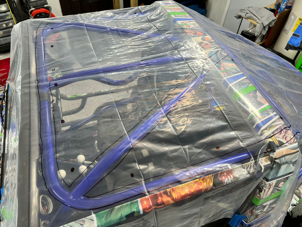Plastic from the custom shape shade top kit on top of greengojohns build with markings to outline rollcage