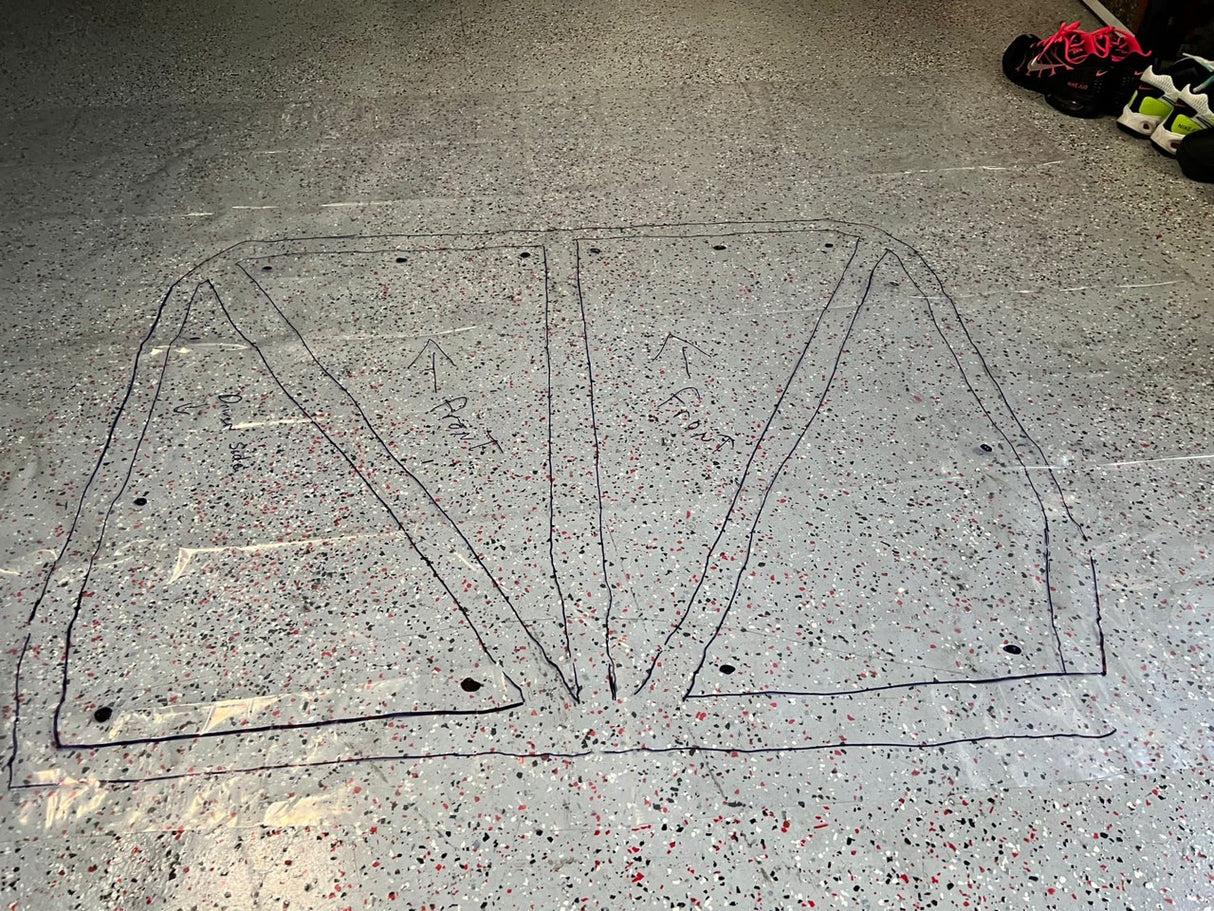 Completed template of greengo johns cage for his build laid out on floor with markings on it.