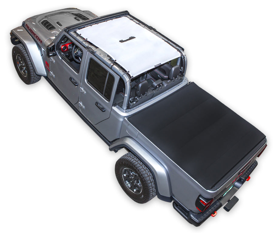Silver Gladiator JT four door Jeep with white SPIDERWEBSHADE shade on top that covers front and rear passenger seats.