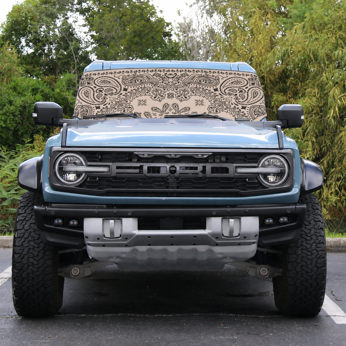 Ford Bronco Raptor front view with tan bandana print Solar Shield on windshield | Spider Web Shade