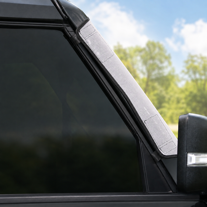 Close-up of Solar Shield installed on Ford Bronco windshield corner | Spider Web Shade