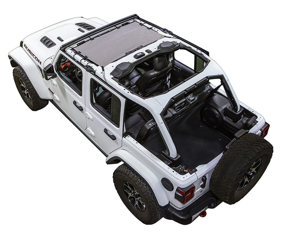 White Rubicon JL four door Jeep with grey SPIDERWEBSHADE shade on top that only covers front seat riders from windshield frame extending to the rear to the sound bar. 