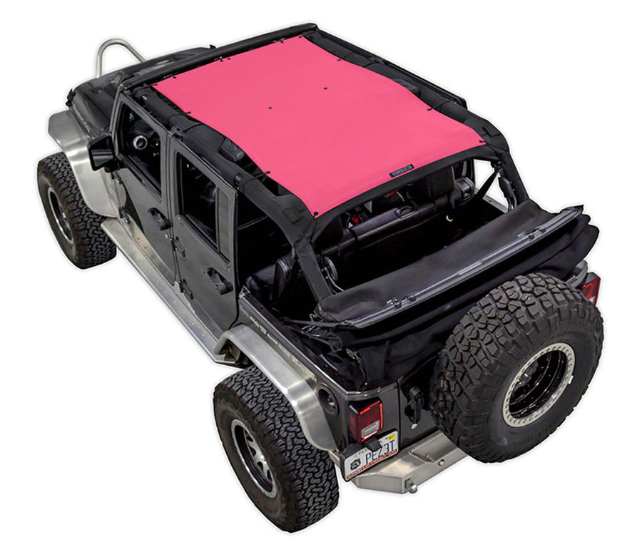Black Rubicon JK four door Jeep with pink SPIDERWEBSHADE shade on top that covers front and rear passenger seats. 
