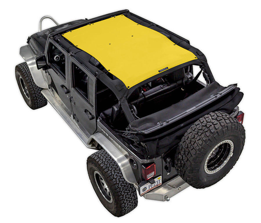 Black Rubicon JK four door Jeep with yellow SPIDERWEBSHADE shade on top that covers front and rear passenger seats. 