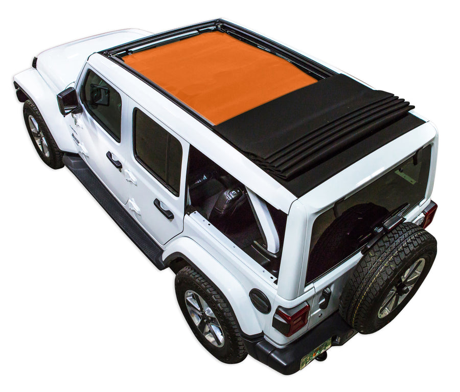White  JL four door Power Top Jeep with orange SPIDERWEBSHADE shade on top that covers front and rear passenger seats.