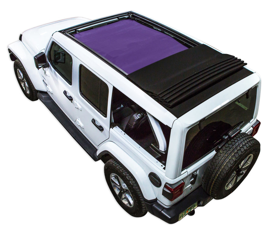 White  JL four door Power Top Jeep with purple SPIDERWEBSHADE shade on top that covers front and rear passenger seats.