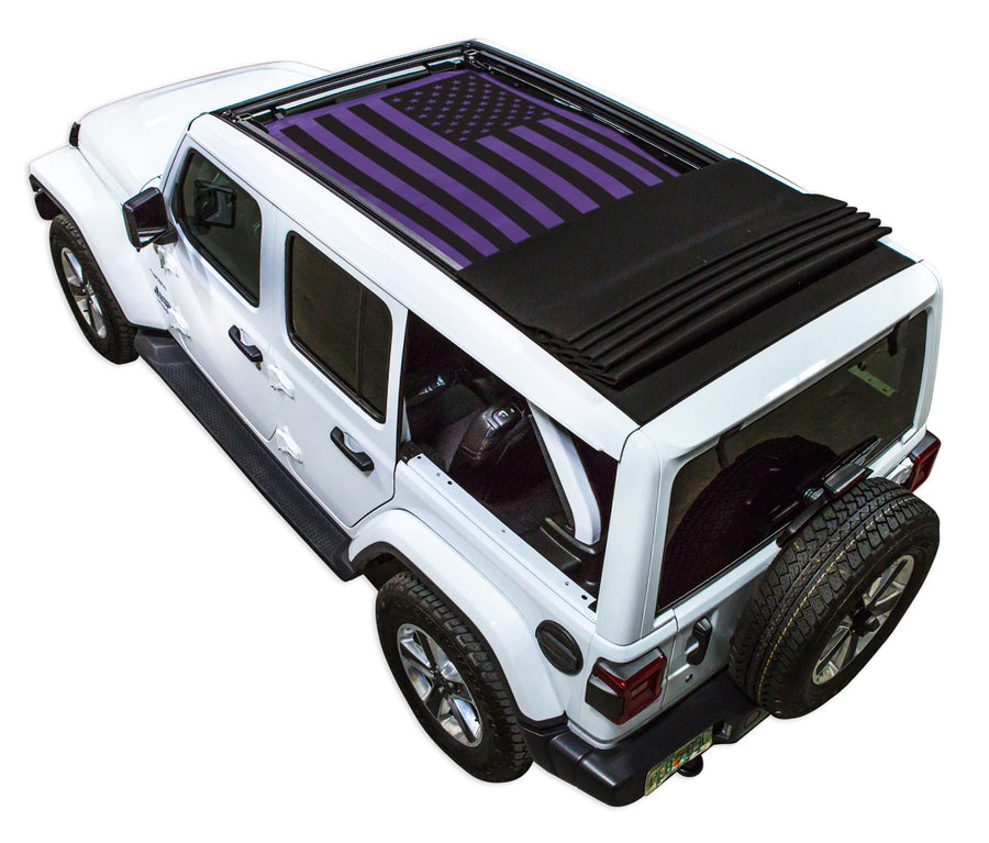 White JL four door Power Top Jeep with Solid Tactical American Flag purple SPIDERWEBSHADE shade on top that covers front and rear passenger seats.