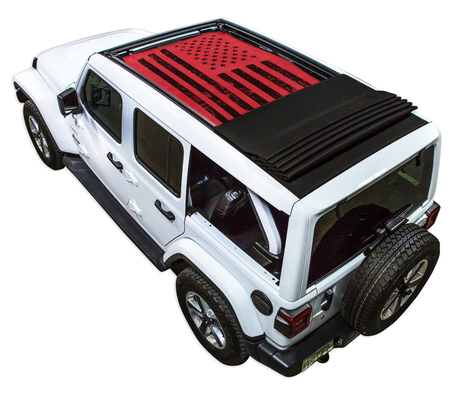 White JL four door Power Top Jeep with Distressed Tactical American Flag red SPIDERWEBSHADE shade on top that covers front and rear passenger seats.