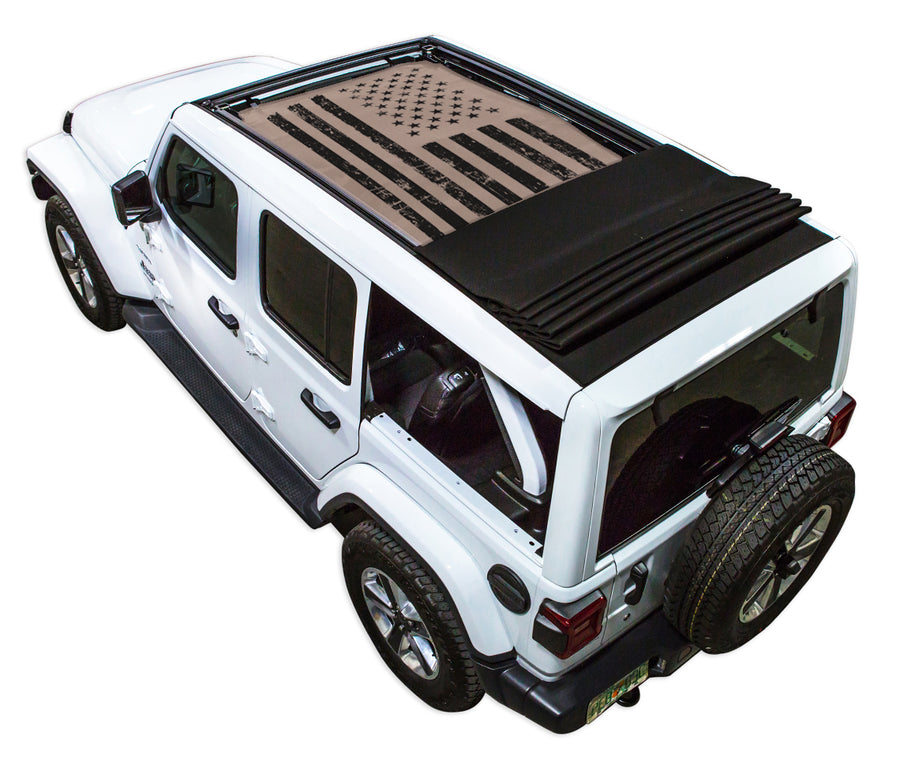 White JL four door Power Top Jeep with Distressed Tactical American Flag tan SPIDERWEBSHADE shade on top that covers front and rear passenger seats.
