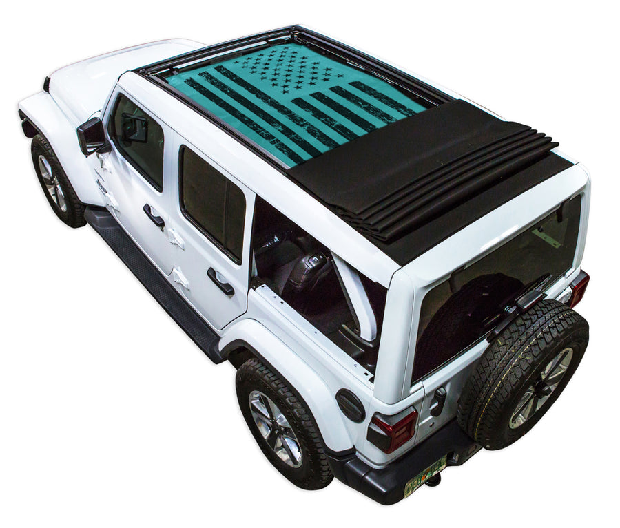 White JL four door Power Top Jeep with Distressed Tactical American Flag teal SPIDERWEBSHADE shade on top that covers front and rear passenger seats.