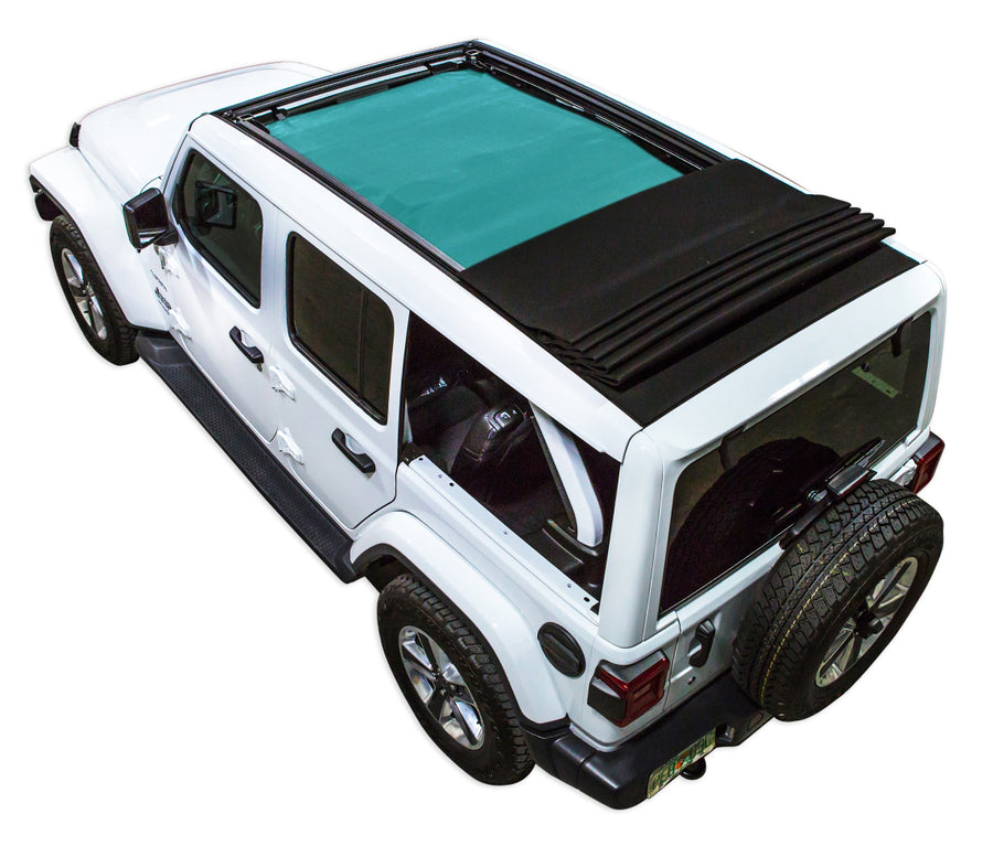 White JL four door Power Top Jeep with teal SPIDERWEBSHADE shade on top that covers front and rear passenger seats.