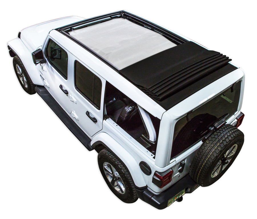 White JL four door Power Top Jeep with white SPIDERWEBSHADE shade on top that covers front and rear passenger seats.