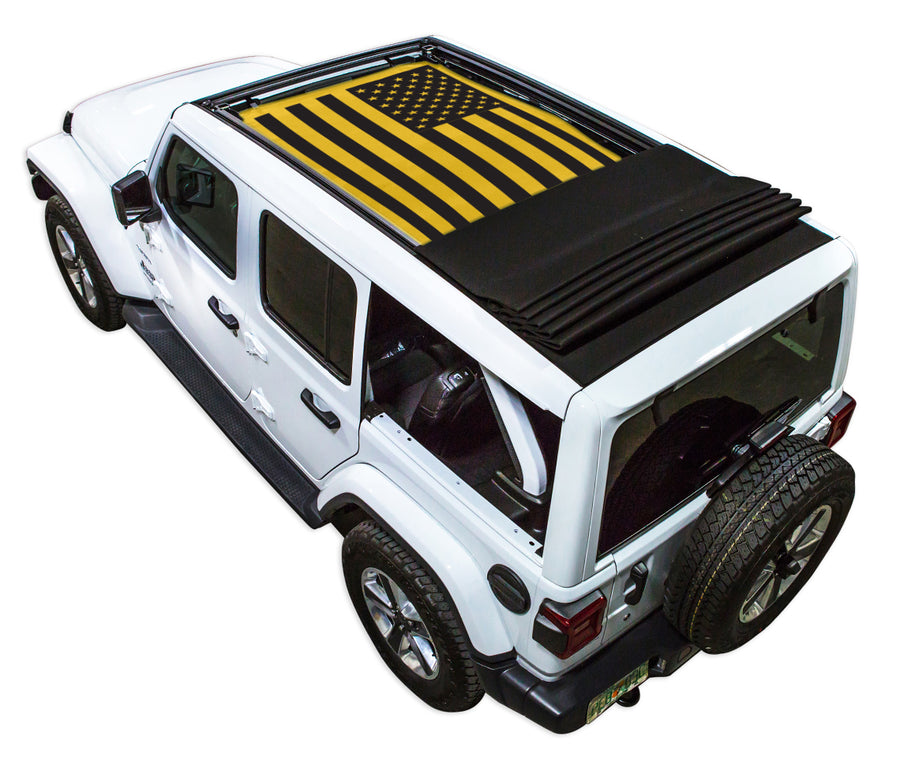 White JL four door Power Top Jeep with Solid Tactical American Flag yellow SPIDERWEBSHADE shade on top that covers front and rear passenger seats.