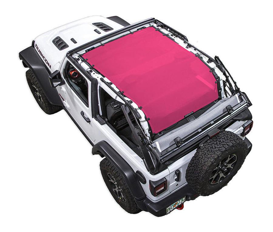 White Rubicon JL two door Jeep with pink SPIDERWEBSHADE shade on top that covers entire roof of jeep and extends to roll cage /tailgate/ cargo area.