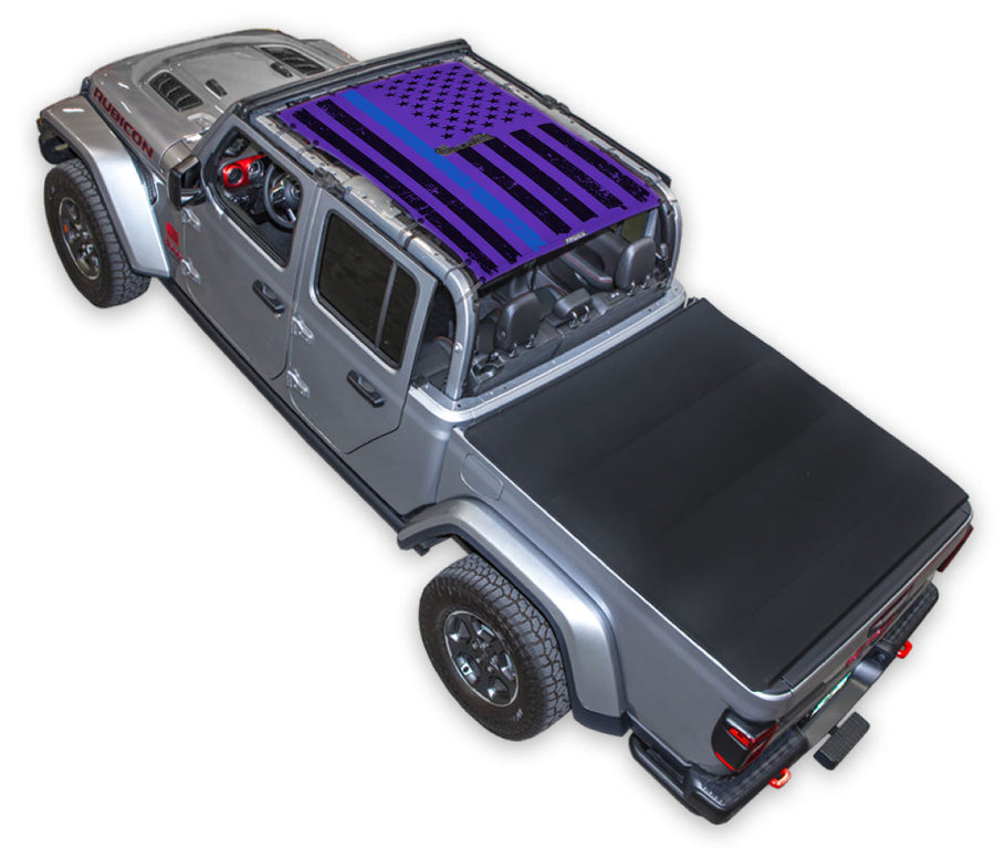Silver Gladiator JT four door Jeep with Distressed Thin Blue Line tactical Flag Purple SPIDERWEBSHADE shade on top that covers front and rear passenger seats.
