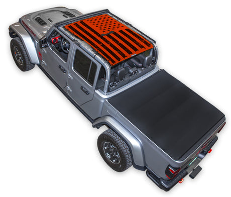 Silver Gladiator JT four door Jeep with Distressed tactical Flag red SPIDERWEBSHADE shade on top that covers front and rear passenger seats.