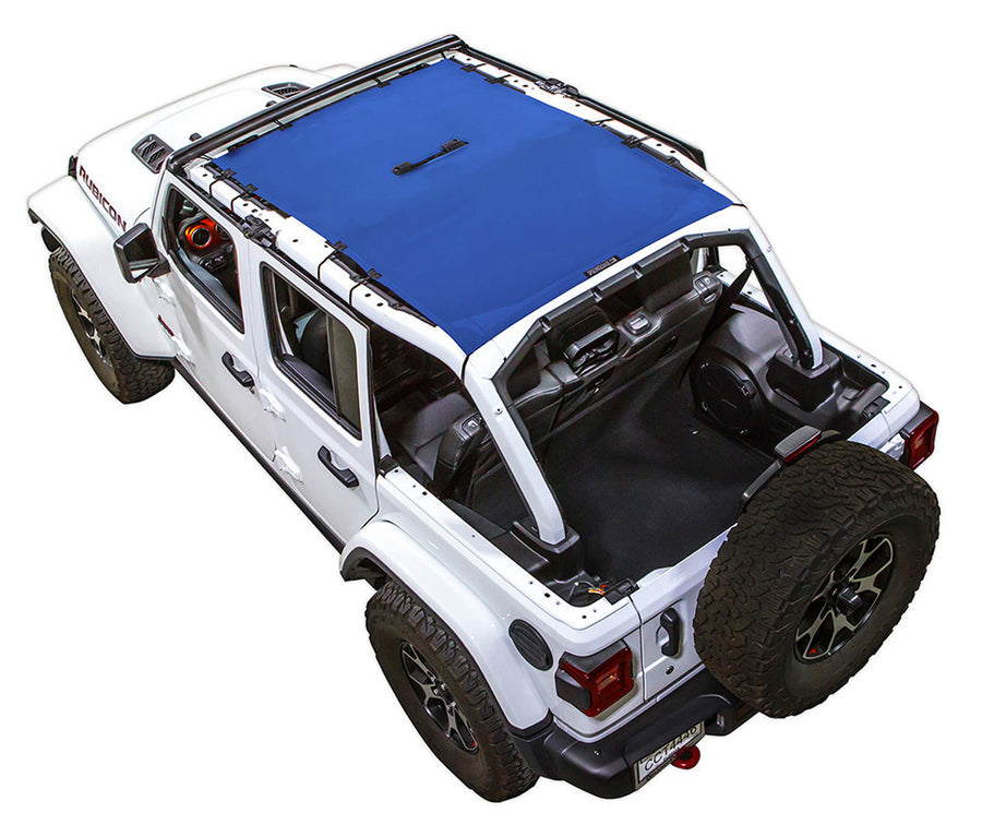 White Rubicon JL four door Jeep with blue SPIDERWEBSHADE shade on top that covers front and rear passenger seats. 