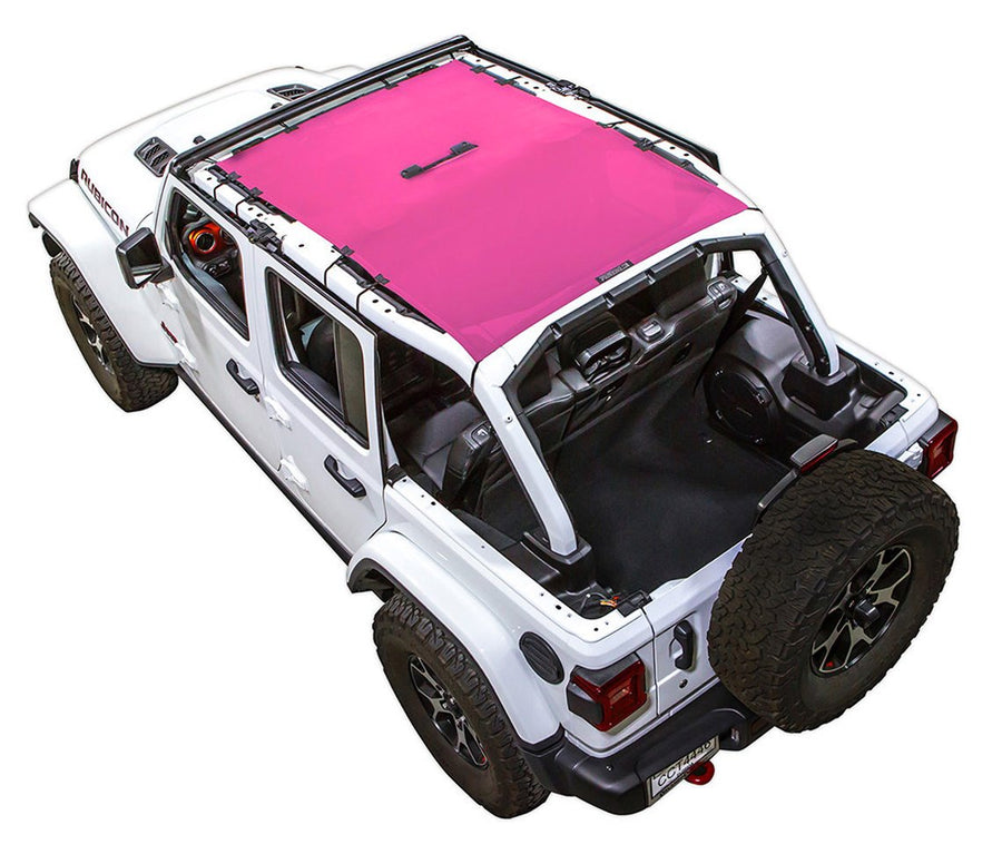 White Rubicon JL four door Jeep with pink SPIDERWEBSHADE shade on top that covers front and rear passenger seats.