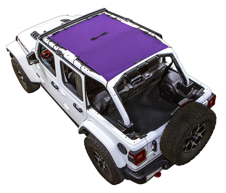 White Rubicon JL four door Jeep with purple SPIDERWEBSHADE shade on top that covers front and rear passenger seats.