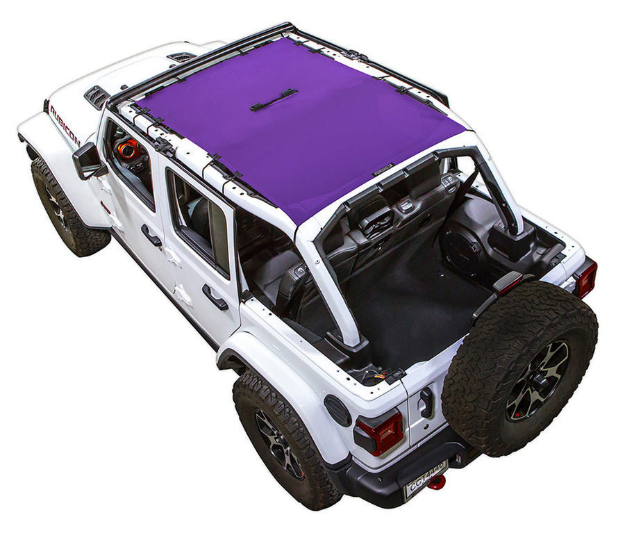 White Rubicon JL four door Jeep with purple SPIDERWEBSHADE shade on top that covers front and rear passenger seats. 