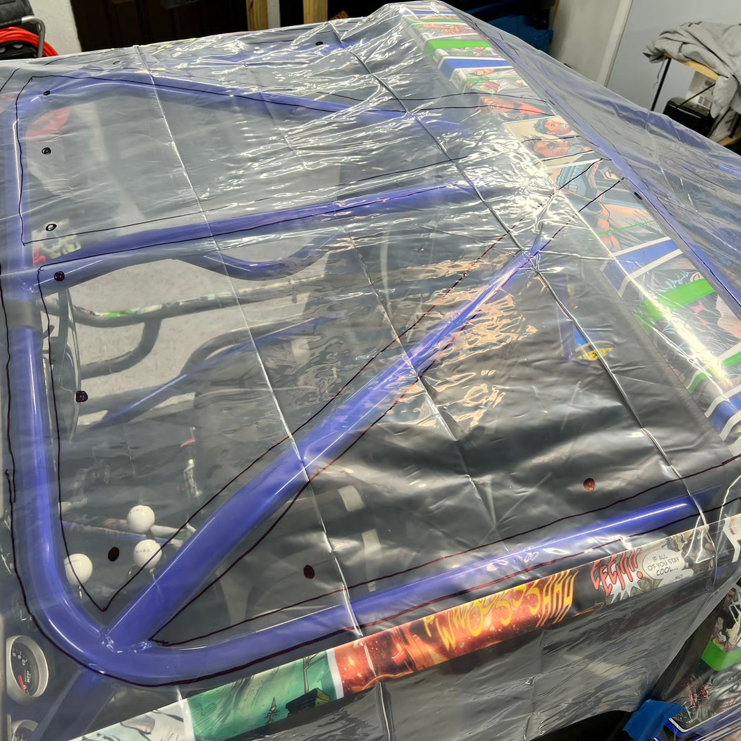 Plastic from the custom shape shade top kit on top of greengojohns build with markings to outline rollcage