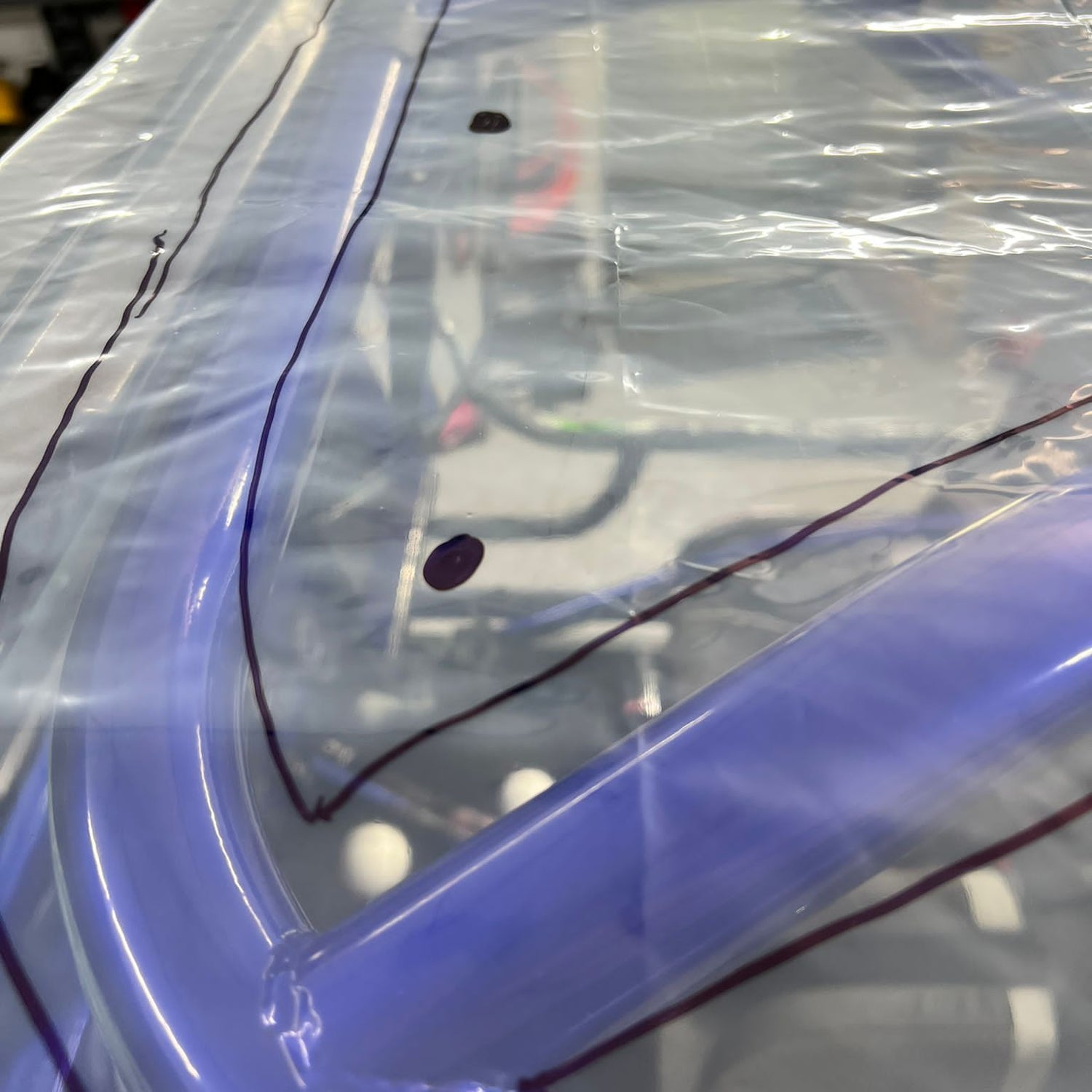 Plastic from the custom shape shade top kit on top of greengojohns build with markings to outline rollcage