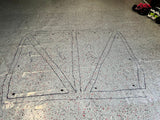 Completed template of greengo johns cage for his build laid out on floor with markings on it. 