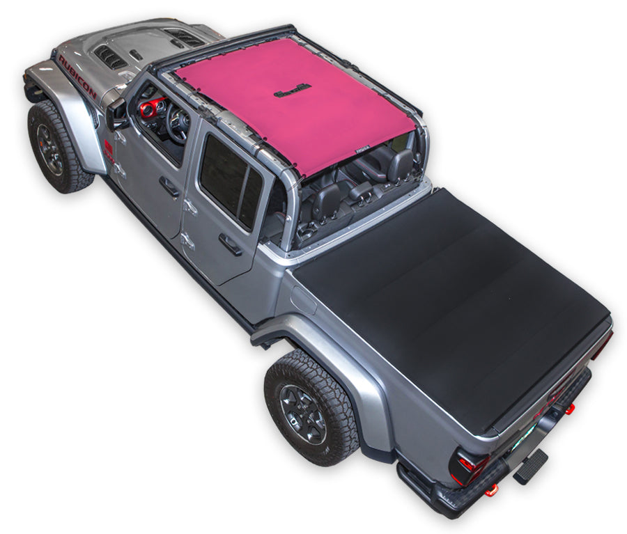 Silver Gladiator JT four door Jeep with pink SPIDERWEBSHADE shade on top that covers front and rear passenger seats. 