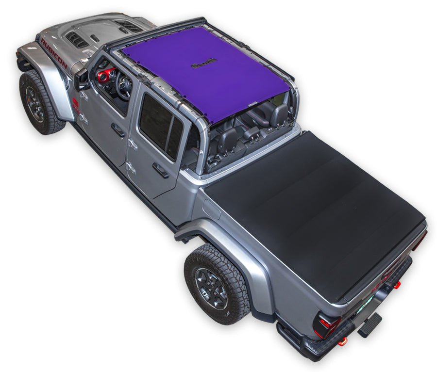 Silver Gladiator JT four door Jeep with purple SPIDERWEBSHADE shade on top that covers front and rear passenger seats. 