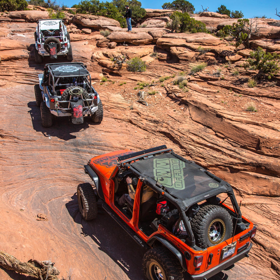 Custom printed shade tops and trailsacs on Jeeps off roading in Moab